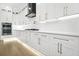 Bright kitchen featuring white cabinets, stainless steel appliances, and modern countertops at 5175 Cascade Rd, Atlanta, GA 30331