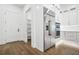 Stainless steel refrigerator and appliances compliment the white cabinetry in this bright, spacious kitchen at 5175 Cascade Rd, Atlanta, GA 30331