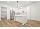 Modern kitchen with stainless steel appliances, hardwood floors, and an island with white countertop at 5175 Cascade Rd, Atlanta, GA 30331
