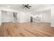Open concept living room features hardwood floors, stairs, and a view of kitchen and island at 5175 Cascade Rd, Atlanta, GA 30331