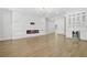Elegant living room with a modern fireplace, stylish lighting, and hardwood floors at 5175 Cascade Rd, Atlanta, GA 30331