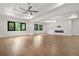 Large open floor plan with hardwood floors and a modern fireplace feature wall with lighting at 5175 Cascade Rd, Atlanta, GA 30331