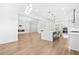 Spacious open-concept layout with modern kitchen, elegant fireplace, and hardwood floors at 5175 Cascade Rd, Atlanta, GA 30331