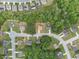 An aerial view shows a well-planned neighborhood with lush greenery and manicured lawns at 871 Wisteria View Ct, Dacula, GA 30019