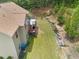 Side yard with a two story deck and retaining wall at 871 Wisteria View Ct, Dacula, GA 30019