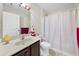 Bathroom featuring a vanity with a marble countertop and a shower with a curtain at 871 Wisteria View Ct, Dacula, GA 30019