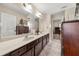 Bright bathroom featuring double sinks and a large mirror, offering a blend of style and functionality at 871 Wisteria View Ct, Dacula, GA 30019