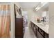 Well-lit bathroom featuring a long vanity with double sinks and decorative touches for a spa-like feel at 871 Wisteria View Ct, Dacula, GA 30019