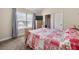 Cozy bedroom with a vaulted ceiling and a large window at 871 Wisteria View Ct, Dacula, GA 30019