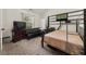 Cozy bedroom with a bunk bed, futon, and study area, perfect for a or guest room at 871 Wisteria View Ct, Dacula, GA 30019