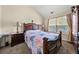 Bedroom featuring a dark wood furniture set and a window with natural light at 871 Wisteria View Ct, Dacula, GA 30019