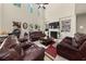 Bright, open living room features high ceilings, a fireplace, and built-in bookshelves at 871 Wisteria View Ct, Dacula, GA 30019
