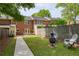 A backyard featuring a lawn, patio, and seating area, great for relaxation and entertaining at 1092 Old Roswell Rd, Roswell, GA 30076