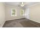 Neutral bedroom features two windows and plush carpeting, offering a comfortable and serene living space at 1092 Old Roswell Rd, Roswell, GA 30076