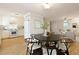 Bright eat-in kitchen with white cabinetry, stainless appliances, and wood flooring at 1092 Old Roswell Rd, Roswell, GA 30076
