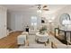 Bright living room with white sofa, accent chairs, and modern decor at 1092 Old Roswell Rd, Roswell, GA 30076