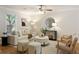Bright living room with neutral decor, hardwood floors, and stylish furnishings at 1092 Old Roswell Rd, Roswell, GA 30076
