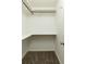 A walk-in closet with carpeted floors, built-in shelving, and hanging racks offers ample storage space at 1092 Old Roswell Rd, Roswell, GA 30076