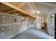 Interior view of a workshop featuring unfinished drywall, overhead lighting, and a partially open ceiling at 1092 Old Roswell Rd, Roswell, GA 30076