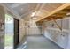 Interior view of a workshop featuring unfinished drywall, overhead lighting, and a partially open ceiling at 1092 Old Roswell Rd, Roswell, GA 30076