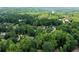 An aerial perspective of a home surrounded by lush green treetops at 1560 Bubbling Creek Ne Rd, Atlanta, GA 30319