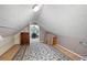 Finished attic space with carpet and neutral walls, perfect for storage or a playroom at 1560 Bubbling Creek Ne Rd, Atlanta, GA 30319