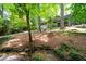 The property features a stream and lush landscape creating a park-like setting and natural beauty at 1560 Bubbling Creek Ne Rd, Atlanta, GA 30319