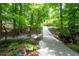 Lush backyard with walking path and serene landscaping at 1560 Bubbling Creek Ne Rd, Atlanta, GA 30319