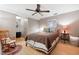 Comfortable bedroom with a ceiling fan, rocking chair, and a light-filled window for a relaxing atmosphere at 1560 Bubbling Creek Ne Rd, Atlanta, GA 30319