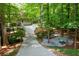 Long driveway amidst lush greenery leading to the house, offering a private and peaceful entrance at 1560 Bubbling Creek Ne Rd, Atlanta, GA 30319