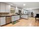 Bright kitchen features stainless steel appliances, tile backsplash, and light hardwood flooring at 1560 Bubbling Creek Ne Rd, Atlanta, GA 30319
