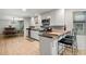 Kitchen features stainless steel appliances, breakfast bar, and open access to the dining area at 1560 Bubbling Creek Ne Rd, Atlanta, GA 30319
