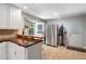 Kitchen with stainless appliances, bar, hardwood floors and access to the outside at 1560 Bubbling Creek Ne Rd, Atlanta, GA 30319