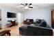 Living room with a wall-mounted TV, recessed lighting, hardwood flooring, and neutral decor at 1560 Bubbling Creek Ne Rd, Atlanta, GA 30319