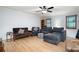 Living room with neutral wall color, ceiling fan, recessed lights, and hardwood flooring at 1560 Bubbling Creek Ne Rd, Atlanta, GA 30319
