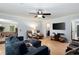 Living room with wall-mounted tv, 2 recliners, hardwood flooring, and an open concept at 1560 Bubbling Creek Ne Rd, Atlanta, GA 30319