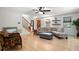 Inviting living room showcasing hardwood floors, a comfortable sofa, and natural light from large windows at 1560 Bubbling Creek Ne Rd, Atlanta, GA 30319