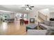 Open-concept living area with hardwood floors connecting living room, dining area, and kitchen at 1560 Bubbling Creek Ne Rd, Atlanta, GA 30319