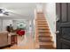 Open-concept first floor with view of staircase, living, dining, and kitchen areas at 1560 Bubbling Creek Ne Rd, Atlanta, GA 30319