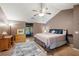 Spacious main bedroom featuring a ceiling fan, light hardwood floors, and a comfortable study corner at 1560 Bubbling Creek Ne Rd, Atlanta, GA 30319
