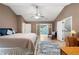 Spacious main bedroom featuring light hardwood floors and a connecting room with french doors at 1560 Bubbling Creek Ne Rd, Atlanta, GA 30319