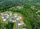 Community aerial view showing proximity to the clubhouse, tennis courts and swimming pool; lush surrounding trees at 17 Ridgeline Nw Way, Cartersville, GA 30121