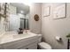 Modern bathroom with a stylish vanity, framed mirror, and a glass-enclosed shower at 17 Ridgeline Nw Way, Cartersville, GA 30121
