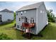 Rear view of a two-story home, complete with a wooden deck and well-maintained landscaping at 17 Ridgeline Nw Way, Cartersville, GA 30121