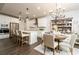 Spacious kitchen with an island, modern lighting, stainless appliances, and an adjacent dining area at 17 Ridgeline Nw Way, Cartersville, GA 30121