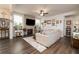 Cozy living room featuring a fireplace, large windows, and hardwood floors at 17 Ridgeline Nw Way, Cartersville, GA 30121