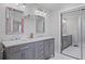 Bathroom with double sink vanity, large mirrors, and sliding door closet at 233 Dorris Sw Dr, Marietta, GA 30060