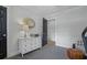Bedroom featuring white dresser with gold mirror and comfy armchair at 233 Dorris Sw Dr, Marietta, GA 30060
