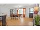 Light-filled dining area with modern chandelier, dining table and chairs and view of the backyard at 233 Dorris Sw Dr, Marietta, GA 30060