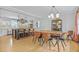 Bright and open kitchen with a dining area with views of the backyard and a dark central island at 233 Dorris Sw Dr, Marietta, GA 30060